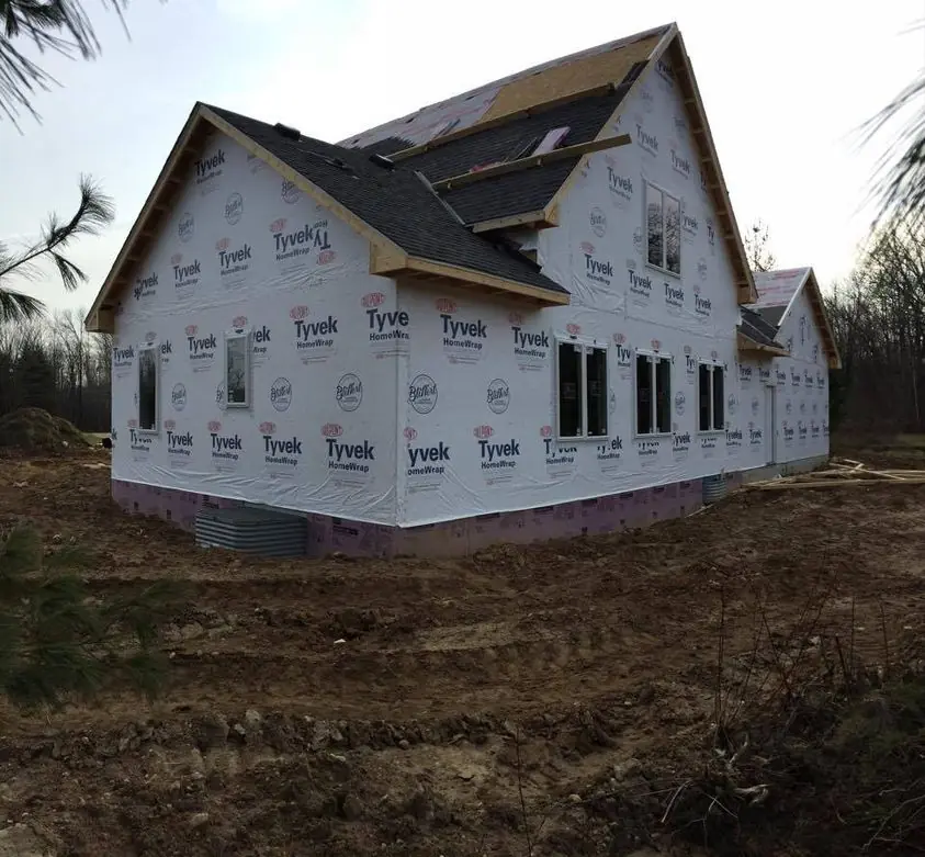 Story-and-a-half home framed and wrapped