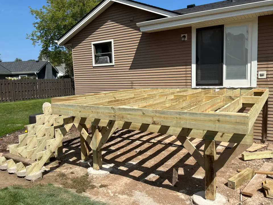 New pressure-treated deck framing and stair stringers