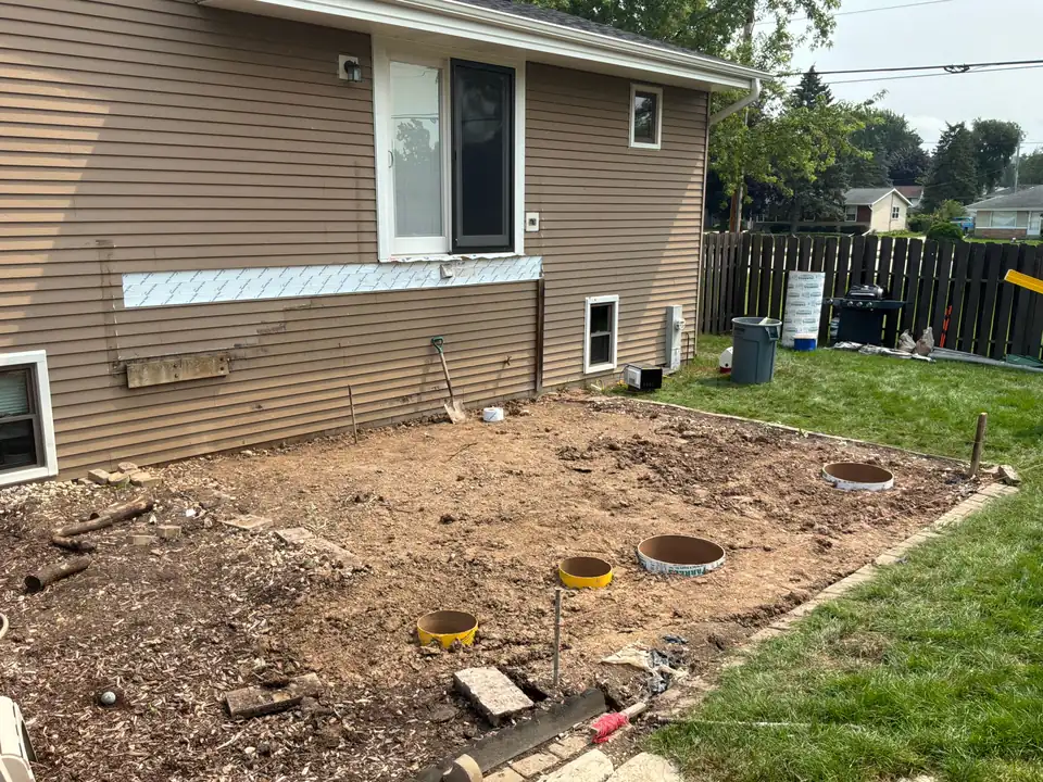 Tear-out & footings: Old deck removed and new concrete footings poured below frost depth.