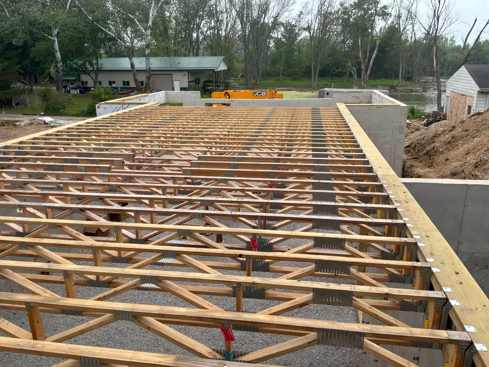 Floor trusses installed over a new foundation