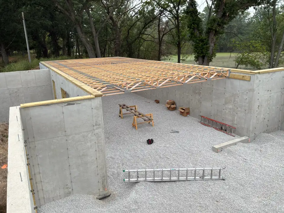 Open-web floor trusses installed on a new foundation