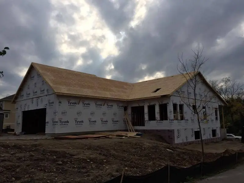 Framed and wrapped home with an attached garage