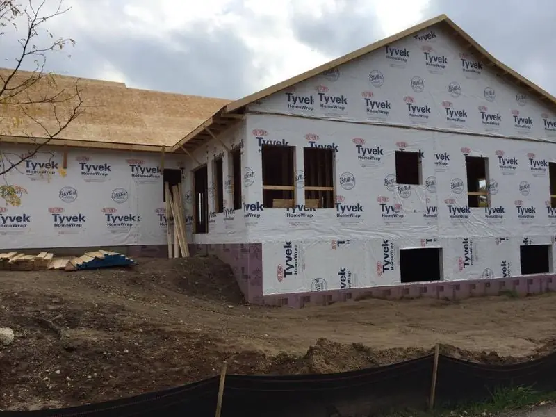 L-shaped ranch framed and wrapped, by G&A Construction