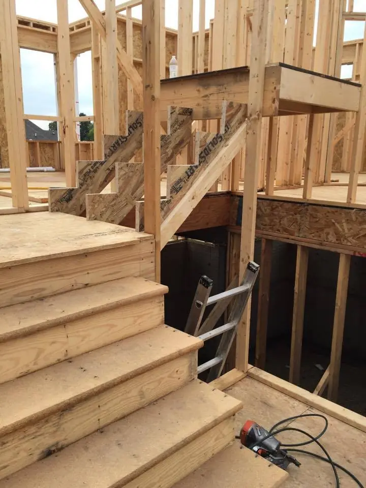 Open stair framing leading to a lower level