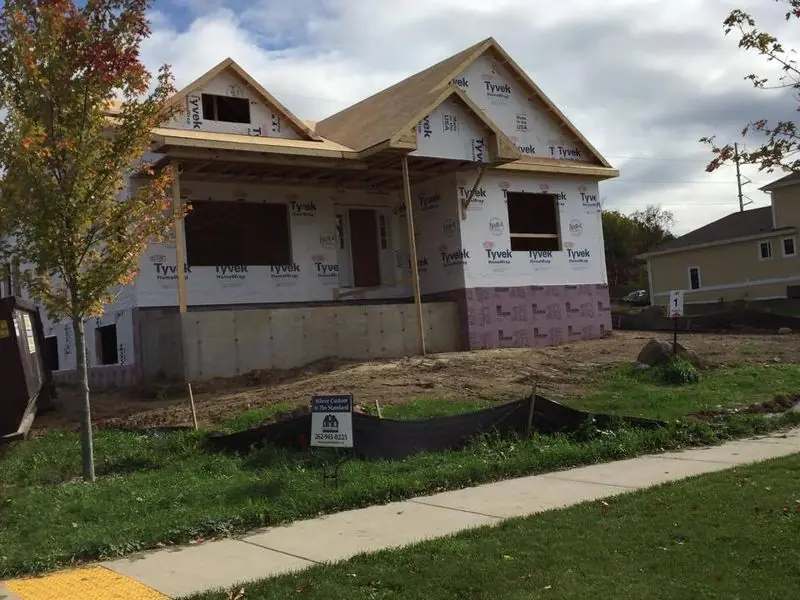 Ranch home with front porch framed, by G&A Construction