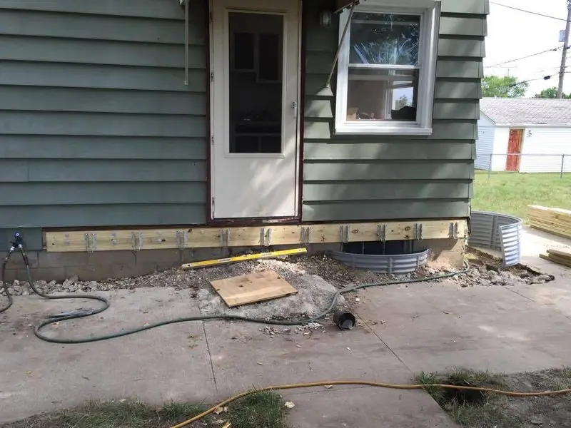 Rotted sill and rim joist repaired before new siding