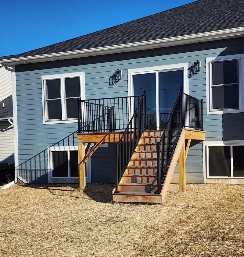 Lap siding and trim on the back of a walkout ranch