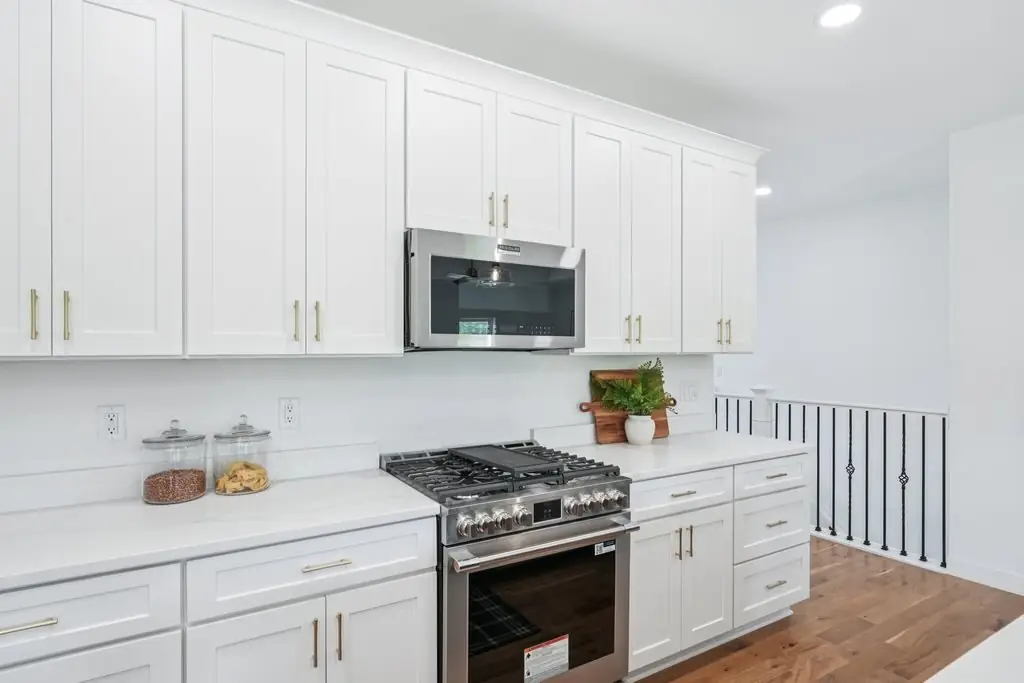 Trim and stair rail beside a kitchen