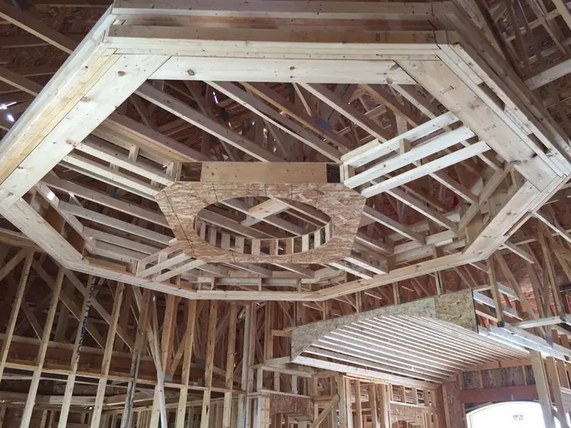 Octagonal tray ceiling framed over a dining room