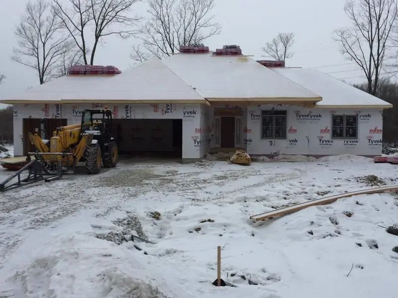 Ranch framed in winter, by G&A Construction